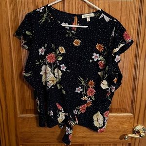 Navy blouse with bright floral pops! Great for spring!
